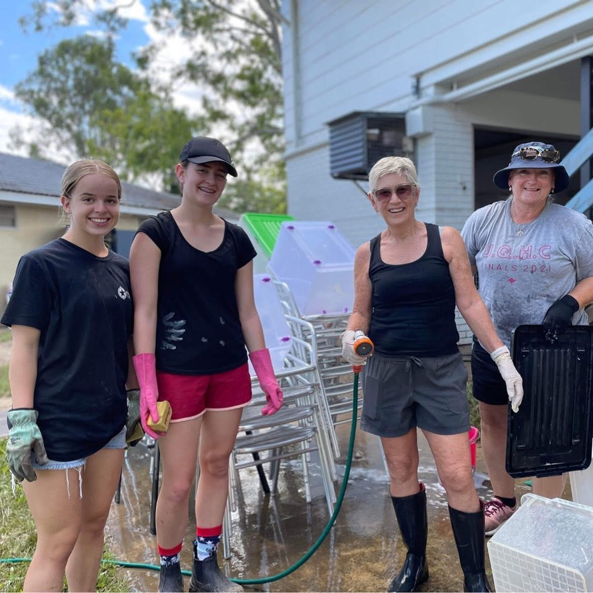 Community members helping clean up the John Rabjones Clubhouse