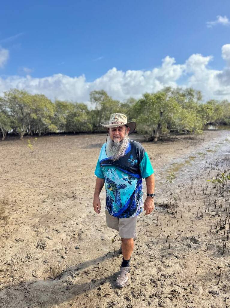 Uncle Franc walks through the mangroves at Fingal Head.