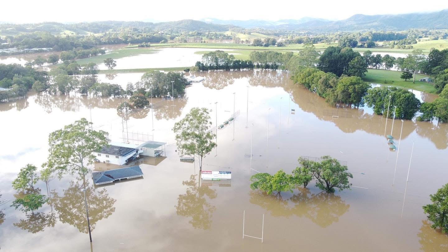 Barrie Smith Fields under water, with just the clubhouse roofs showing above the flood.